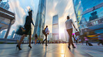 Abstract, walking and motion blur with silhouette effect of workers walking, trading or business. Blurry, lights and modern office buildings. Wallpaper, background and corporate marketing for workforce