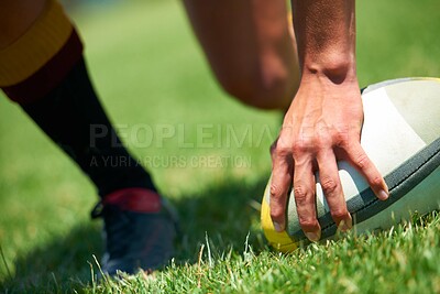 Buy stock photo Closeup shot of a man's hand on a rugby ball
