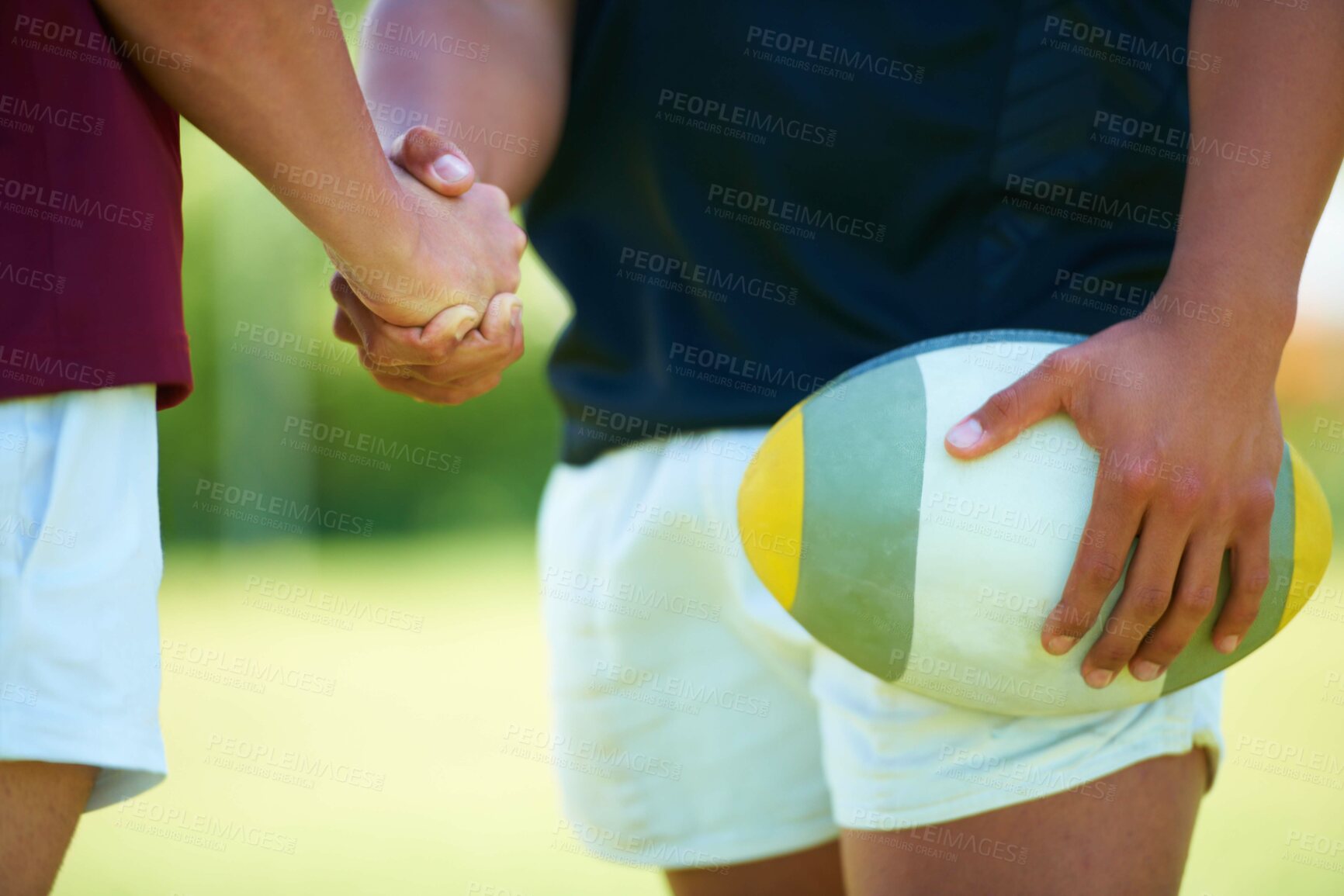 Buy stock photo Closeup, handshake and rugby ball or competition practice and meeting outside. Support, success and sports teamwork with people together for greeting and competitive match on a field with a team 