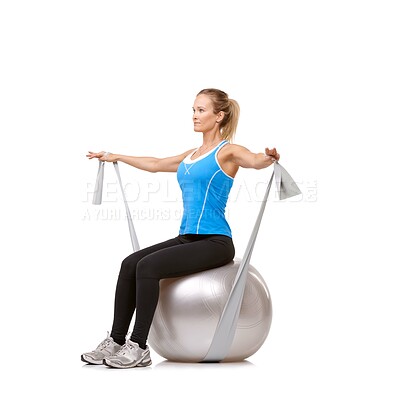 Buy stock photo Exercise ball, resistance band and woman doing workout in studio for health, wellness and body care. Sports, fitness and female person from Canada stretching arms or training by white background