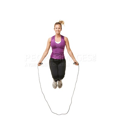 Buy stock photo Jump, skipping rope and portrait of woman on a white background for fitness, workout and training. Sports, happy and isolated person with gym equipment for health, wellness and exercise in studio