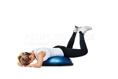 Buy stock photo Woman, balance ball and lying workout, balance or exercise on a white studio background. Young person or athlete on half round object in training, health and wellness or fitness on mockup space