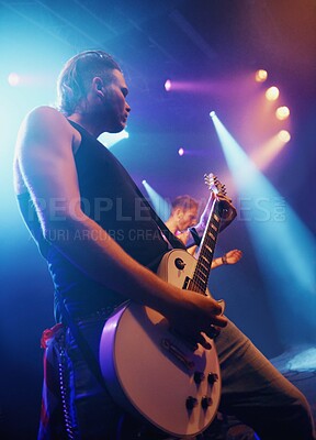 Buy stock photo Music, guitar and lighting with man on stage for concert, show or performance at festival from below. Party, event or entertainment and musician or guitarist playing instrument at musical production