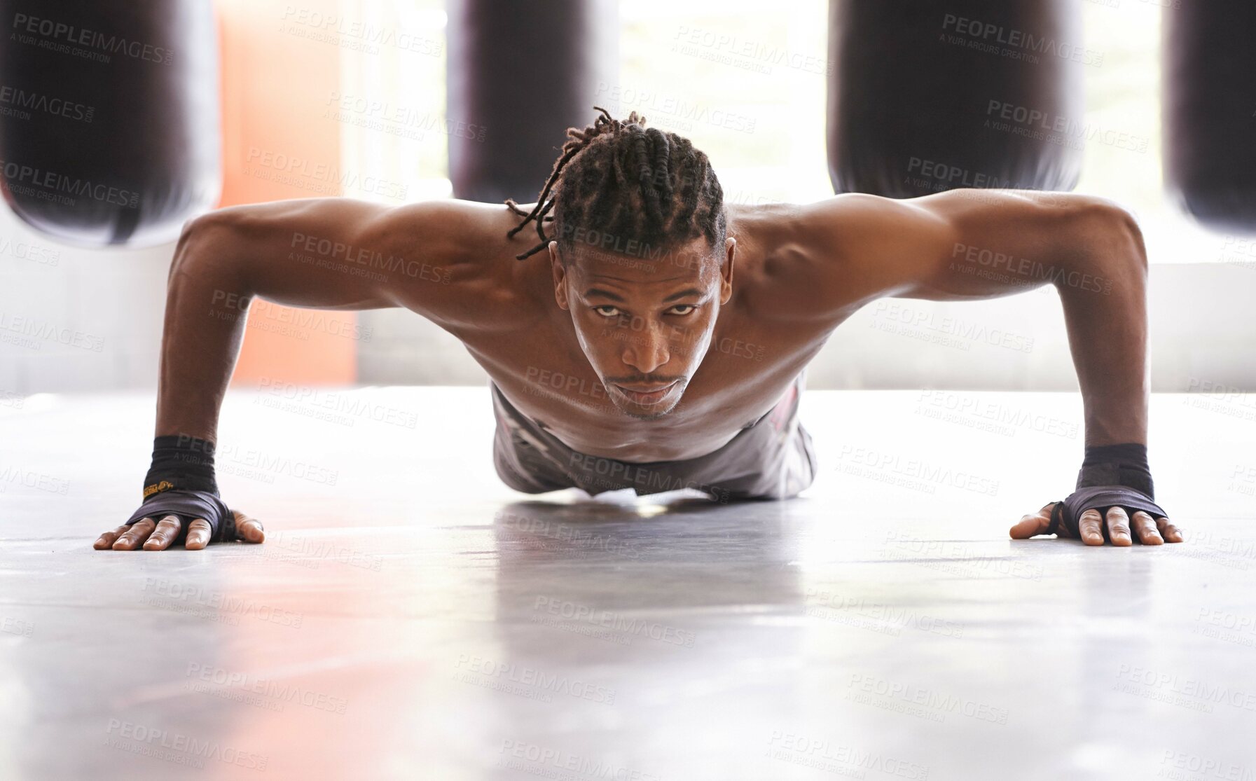Buy stock photo Portrait, exercise and push up with black man on floor of gym for training strong muscles or power. Fitness, health and body with confident young athlete in workout to improve physical wellness