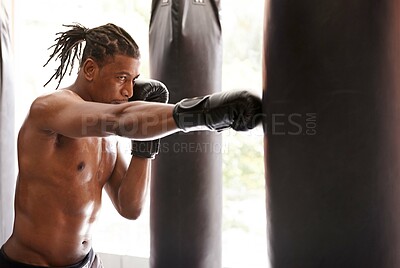 Buy stock photo Muscle, punching bag and black man in gym for exercise, boxing challenge or competition training. Power, fitness and serious champion boxer at workout with confidence, fight and energy in sports club