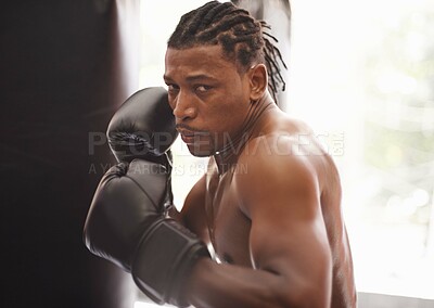 Buy stock photo Challenge, portrait and black man with boxing gloves in gym for fitness, fight and competition training. Power, muscle and serious face of champion boxer at workout with confidence in sports club.