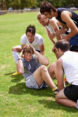 Buy stock photo Man, sit ups for exercise and cheers from team with support and coaching, fitness and training on sports field. Challenge, action and core workout outdoor with athlete friends, motivation and help