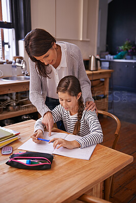 Buy stock photo Studying, mother and daughter for writing with help, advice and check for homework with education. Mom, girl and notebook with drawing, notes and development with learning in kitchen at family house