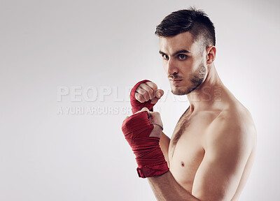 Buy stock photo Fist, MMA and wraps for male fighter or boxer, pose and boxing on white background. Fitness, hands or athlete for exercise and man kickboxer, mockup space or training for impact sports or competition