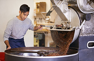 Buy stock photo Coffee, beans and man with machine for roasting with blending, production and quality control. Entrepreneur, barista or roaster with small business at cafe, sustainable startup and espresso process