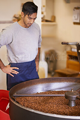 Buy stock photo Coffee, small business and man with machine for roasting with blending, production and quality control. Entrepreneur, barista or roaster with beans at cafe, sustainable startup and espresso process