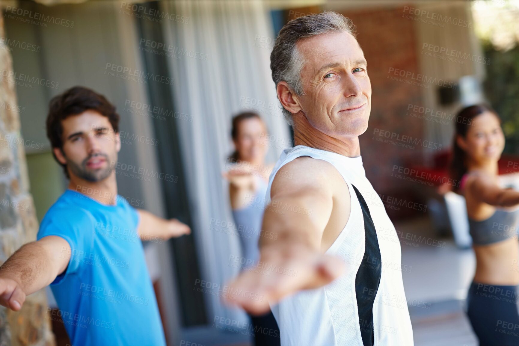 Buy stock photo Mature man, pose and happy in yoga class for fitness and mental wellbeing, workout and daily lesson to coach people. Male yogini, warrior posture and yogis or students practice strength and balance.