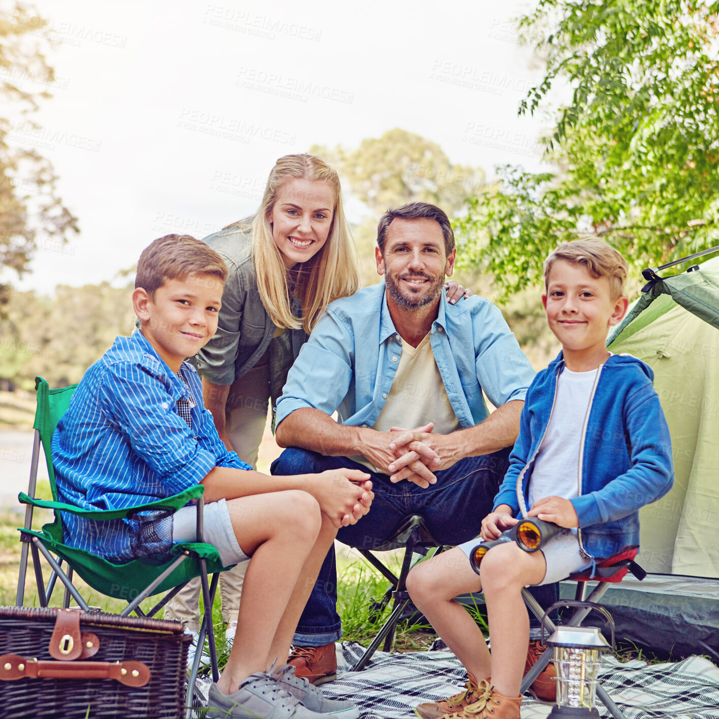 Buy stock photo Cropped portrait of a family of four camping in the woods