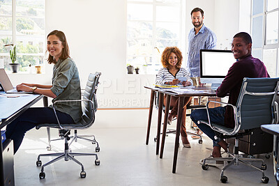 Buy stock photo Portrait of a team of colleagues working in an open plan office