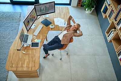 Buy stock photo Portrait of a mature businesswoman taking a break at her office desk