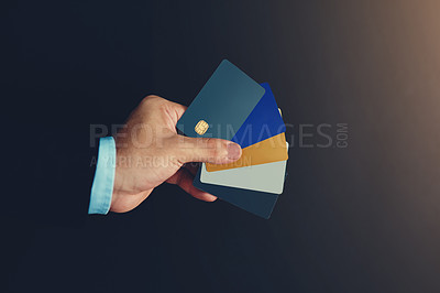 Buy stock photo Businessman, hand and credit card in studio for wireless transaction, credit score and accounting. Financial advisor, payment and e commerce on dark background for payment authorisation and sales