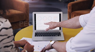 Buy stock photo Shot of a businessman and businesswoman using a laptop in a modern office