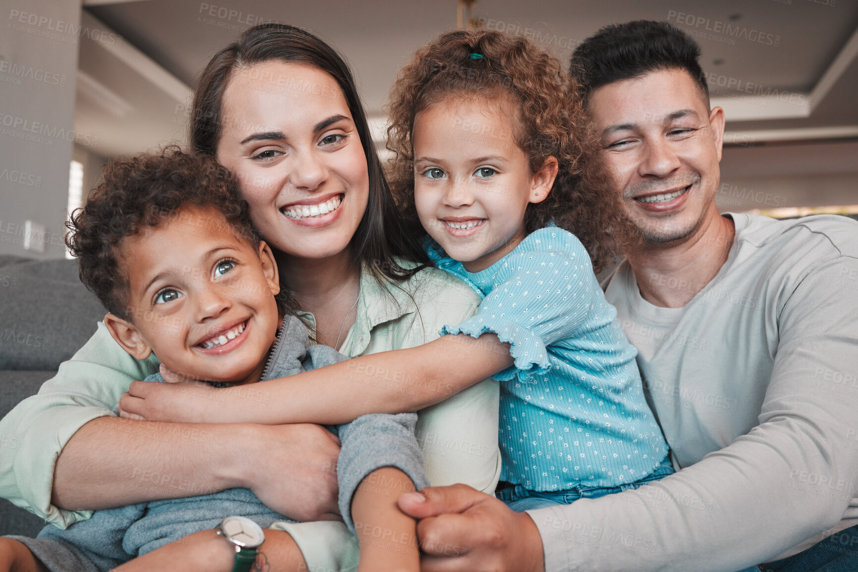 Buy stock photo Shot of a young family spending time together at home