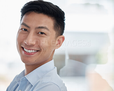 Buy stock photo Asian man, portrait and business with smile for career ambition, entrepreneur or creative mindset at modern office. Face of young businessman leaning on glass wall in confidence for job or reflection