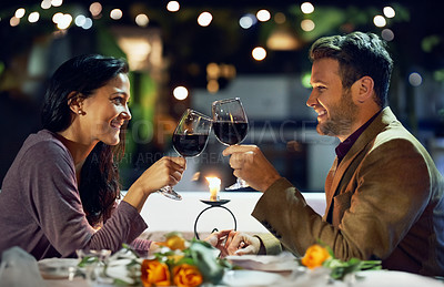 Buy stock photo Smile, couple and cheers with wine at restaurant for date, love or holding hands together. Happy man, woman and toast with drink in glass for celebration, anniversary or romance with bokeh at night
