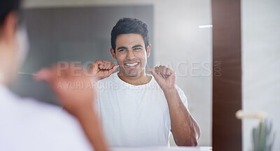 Buy stock photo Happy, mirror and man with floss in bathroom for dental hygiene, gum disease and oral care. Health, mouth and person in reflection after brushing teeth for wellness, cleaning and fresh breath in home