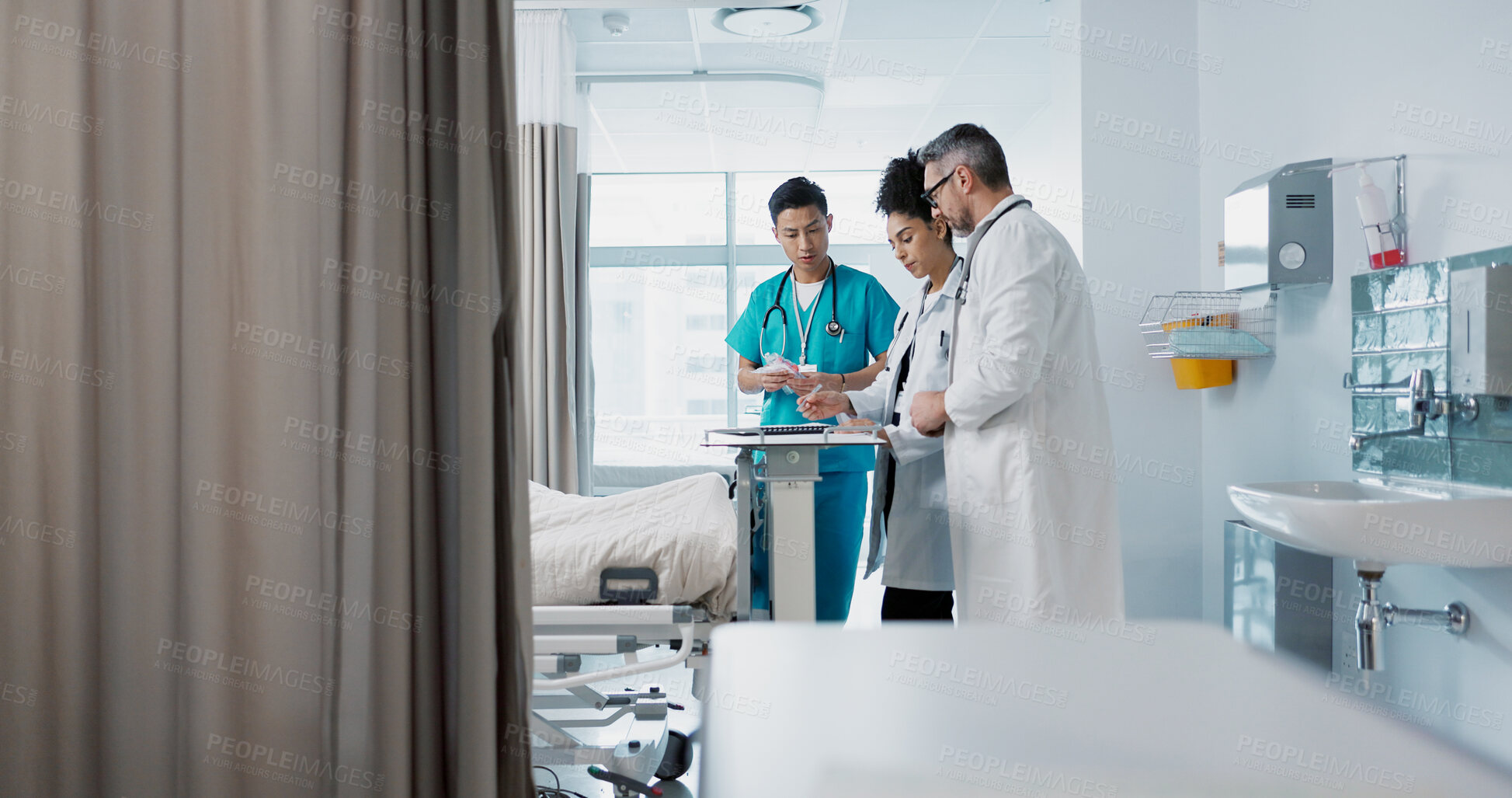 Buy stock photo Healthcare, hospital and a medical team of doctors checking on a patient in recovery or rehabilitation. Medicine, teamwork and consulting with a group of health professionals in a clinic for wellness