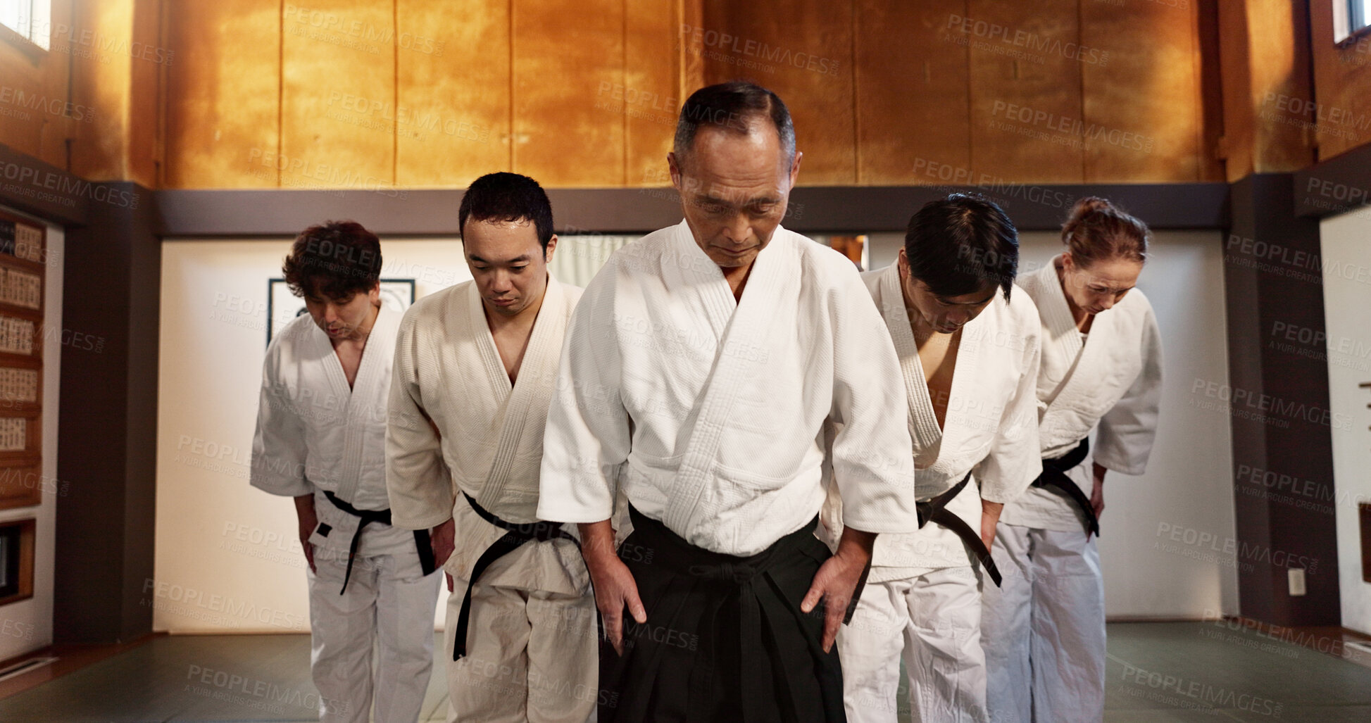 Buy stock photo Japanese people, bow and respect in aikido in dojo place,  training and modern martial arts class of self defence. Group, black belt students and sensei in honor and commitment in fighting discipline