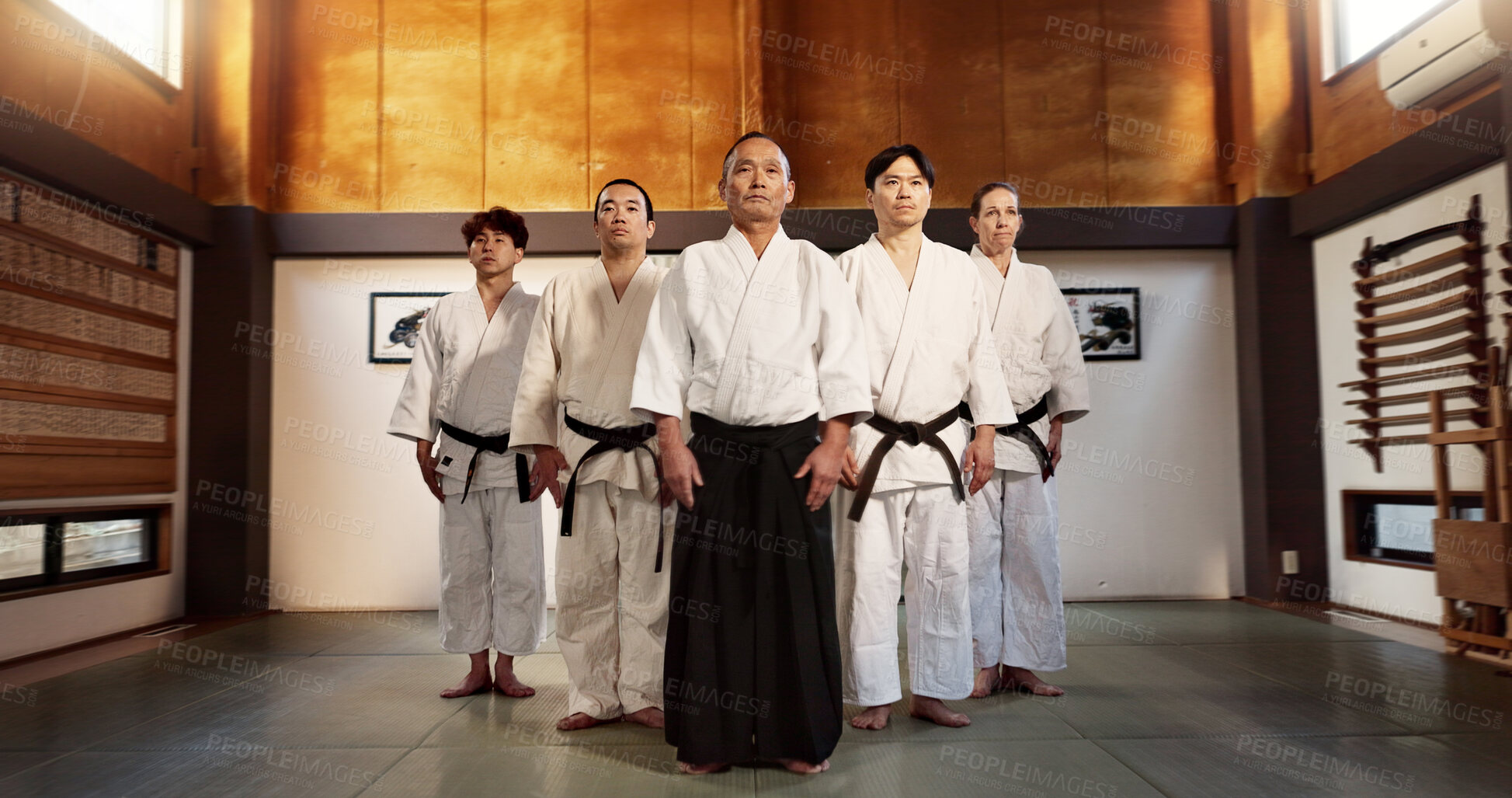 Buy stock photo Aikido class, group and portrait for martial arts, sensei or ready for training, gym or contest in dojo. Japanese people, sport or exercise in club, workout or fitness for fight, black belt or battle