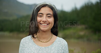 Nature, smile and face of young woman on vacation, weekend trip or adventure in a forest. Happy, travel and portrait of female person from Mexico with positive and good attitude for outdoor adventure
