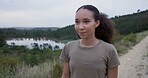 Nature, fitness and young woman running in forest for race, marathon or competition training. Sports, pond and African female athlete runner in outdoor woods for cardio exercise or workout for health