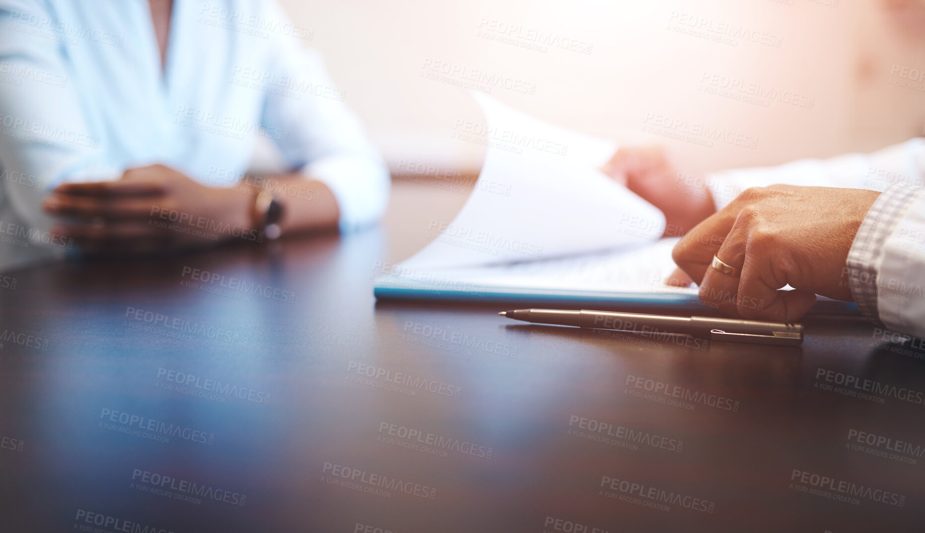 Buy stock photo Closeup shot of an unrecognizable doctor having a consultation with a patient in his office