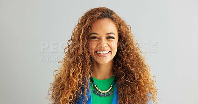 Woman, fashion and smile with necklace in studio on white background, happy and confident with trendy outfit. Closeup, female person and excited with clothes on colorful top with jewelry and style