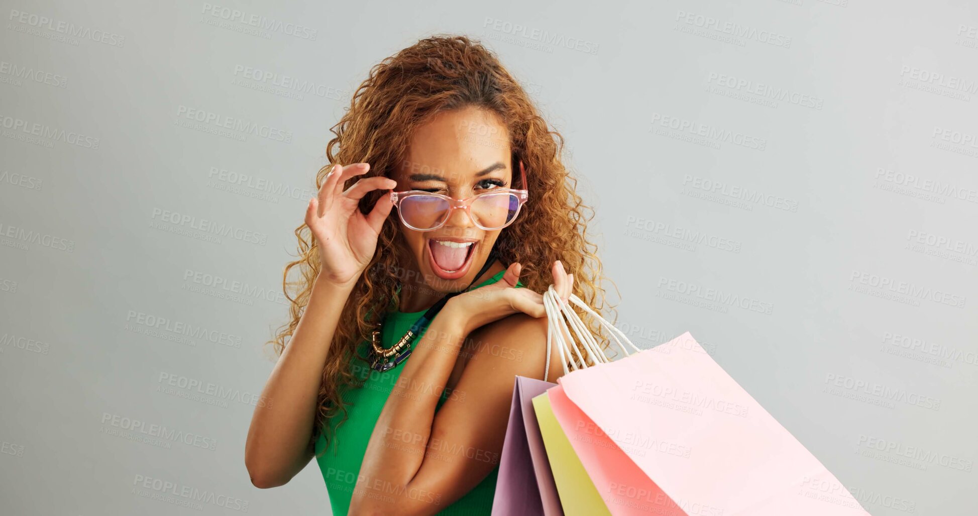 Buy stock photo Woman, glasses and shopping bag in studio for fashion sale, discount and luxury with vision or eye care. Face of a young african person or happy model with cool and trendy style on a white background