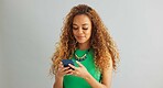 Excited woman, phone and winning with good news, promotion or lottery on a gray studio background. Happy female person with smile, fist pump or mobile smartphone for celebration or success on mockup