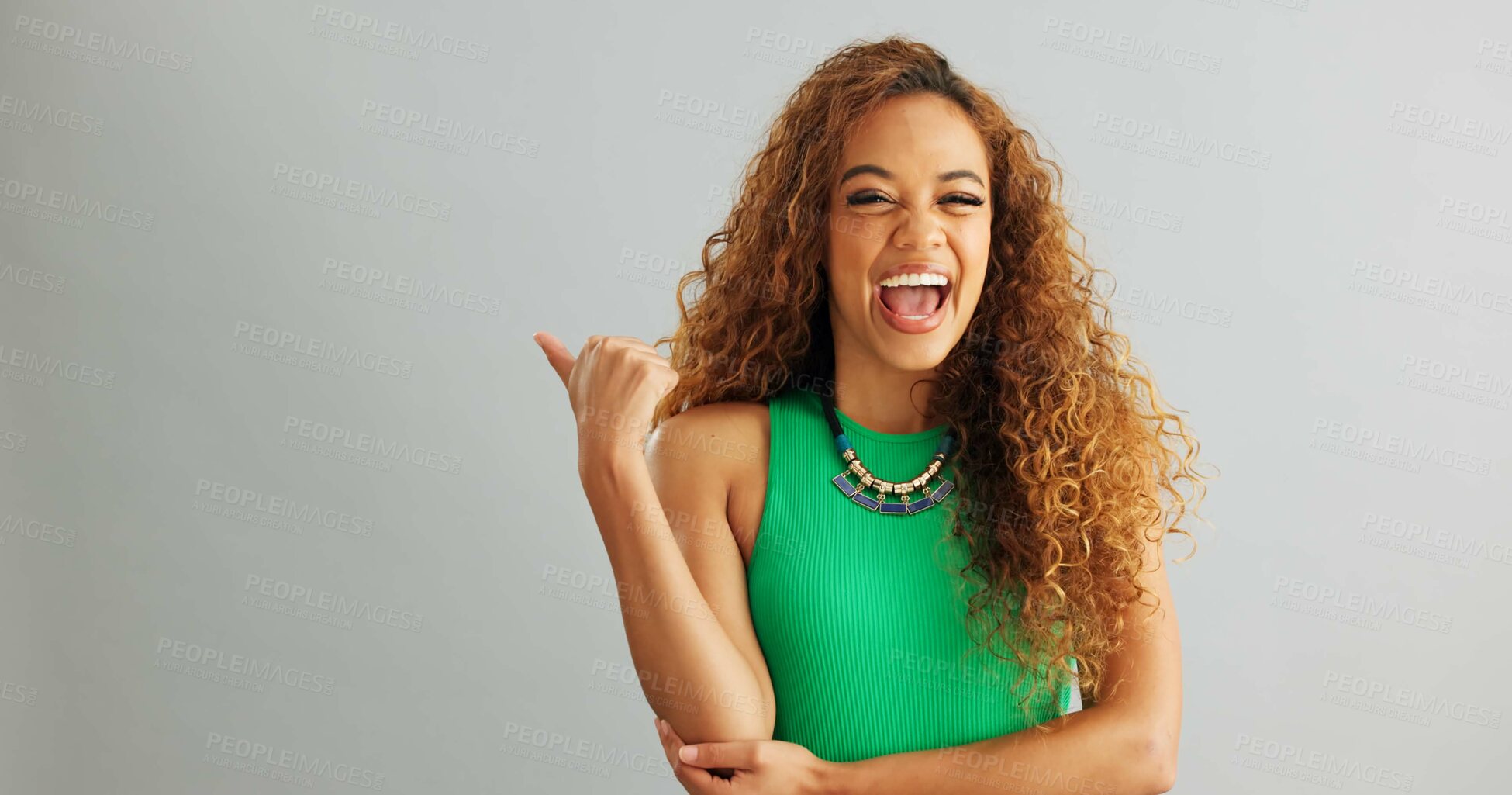 Buy stock photo Happy woman, pointing and advertising with mockup space for marketing on a gray studio background. Portrait of excited female person with smile for notification, alert or discount deal on promotion