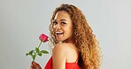 Woman, happy and rose in studio with smile for gift, kindness and gratitude with scent or fragrance on a white background. Face of excited, African person or model with pink flower for valentines day