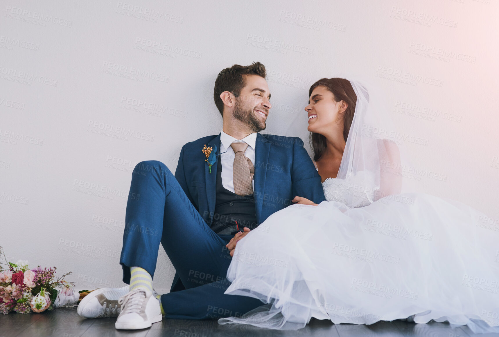 Buy stock photo Bride, groom or together in studio for marriage with smile, wedding with bouquet and trust. Happy couple, unity or white background for commitment to love on floor, excited for partnership in Chicago