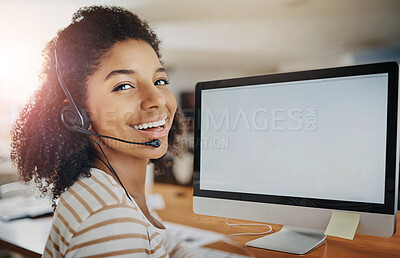 Buy stock photo Portrait of a young woman wearing a headset while working on a computer at home