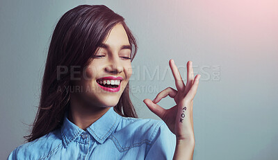 Buy stock photo Studio shot of an attractive young woman making an 