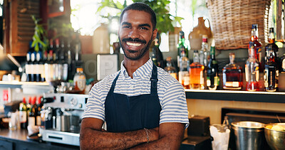 Welcome, coffee shop and confident portrait of man at bar with smile, waiter or manager at restaurant startup. Bistro, service barman and happy small business owner at cafe counter with arms crossed.