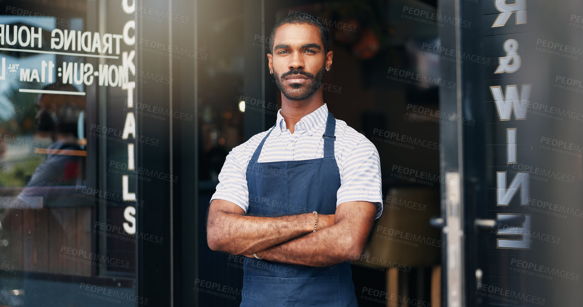 Buy stock photo Proud waiter, man and arms crossed at restaurant for business, welcome or ready for service with confidence. Barista, person and server by entrance of cafe, coffee shop or diner for hospitality and career