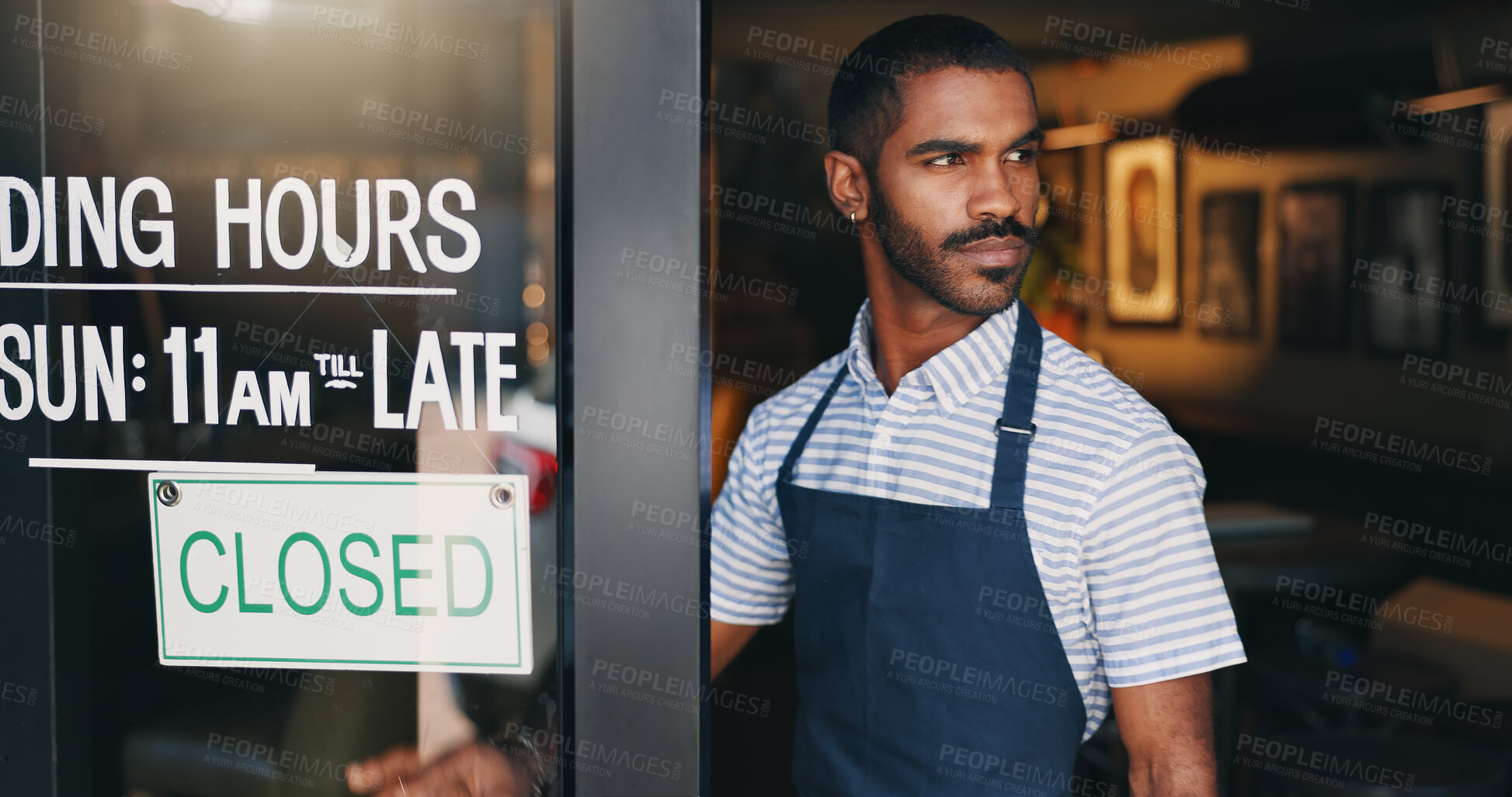 Buy stock photo Man, business owner and restaurant with closed sign, thinking or check at startup, food or barista. Person, entrepreneur or waiter for cafeteria, diner or catering at door in apron, server or ideas