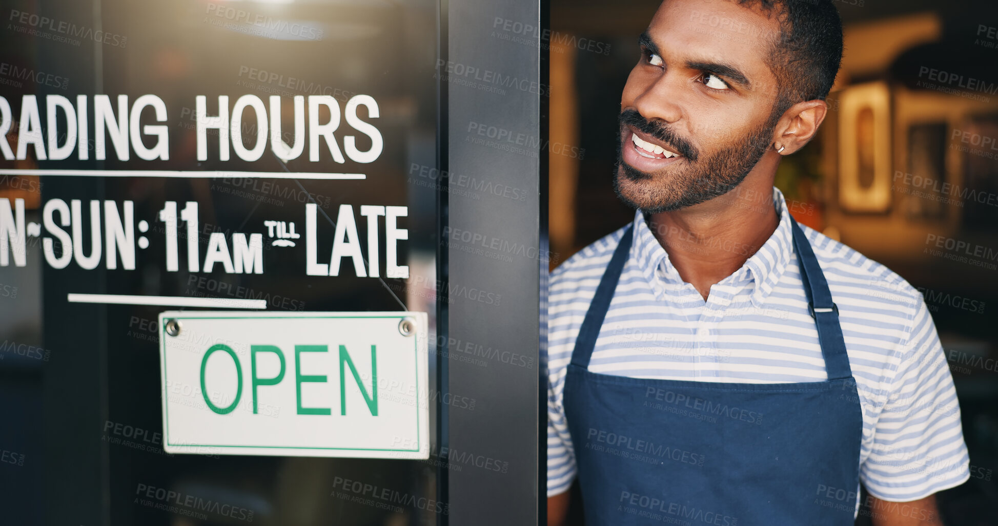 Buy stock photo Open, sign and happy man at window of small business, coffee shop or start of service at restaurant. Store, notice and hands of owner change signage, board or information of operating time and hopeful morning
