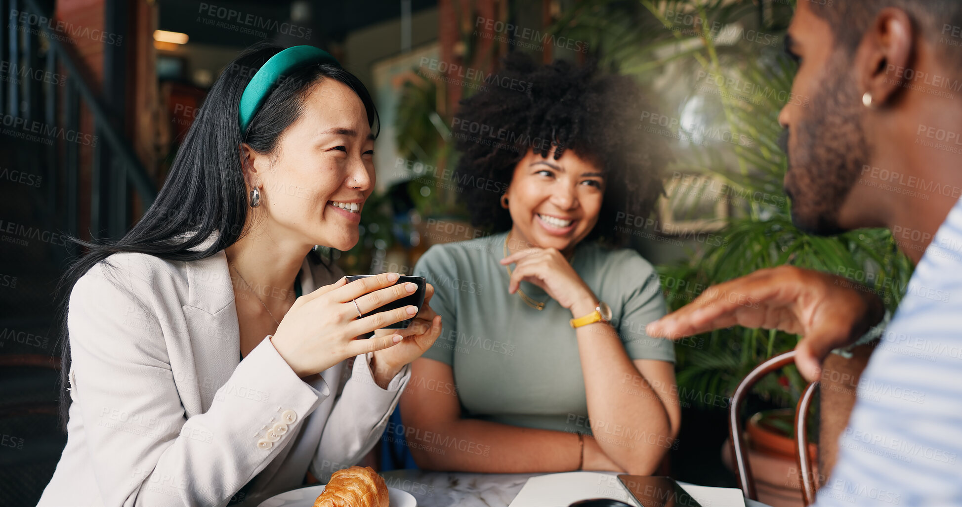 Buy stock photo People, friends and laughing with coffee at cafe for funny joke, discussion or break together. Happy group smile enjoying fun conversation with beverage, croissant or cup of tea at indoor restaurant