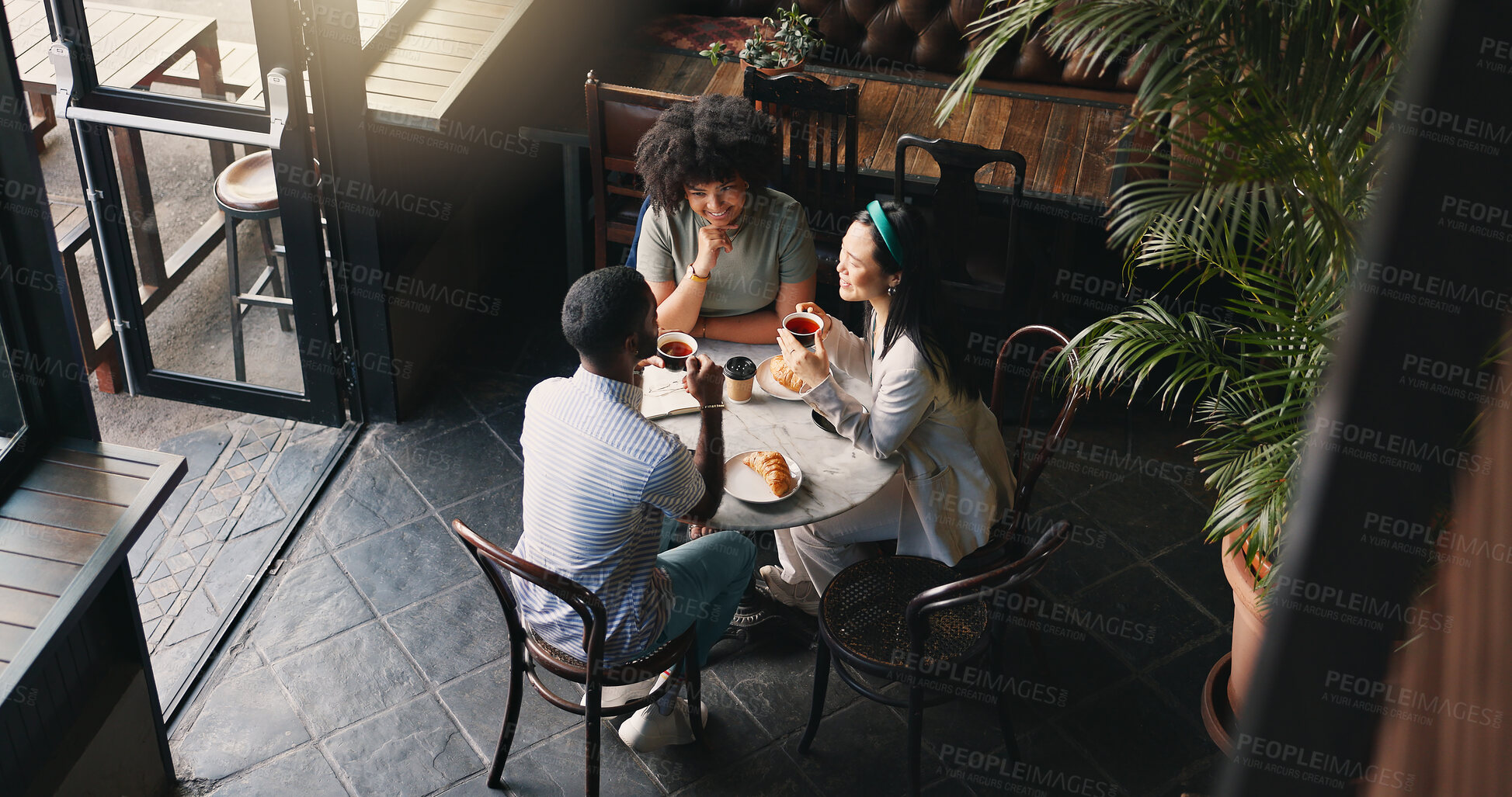 Buy stock photo Friends, group and talking in coffee shop for communication catch up or university reunion, gossip or pastry, Man, woman and chat in cafe together as consumer for bonding lunch, diversity or social