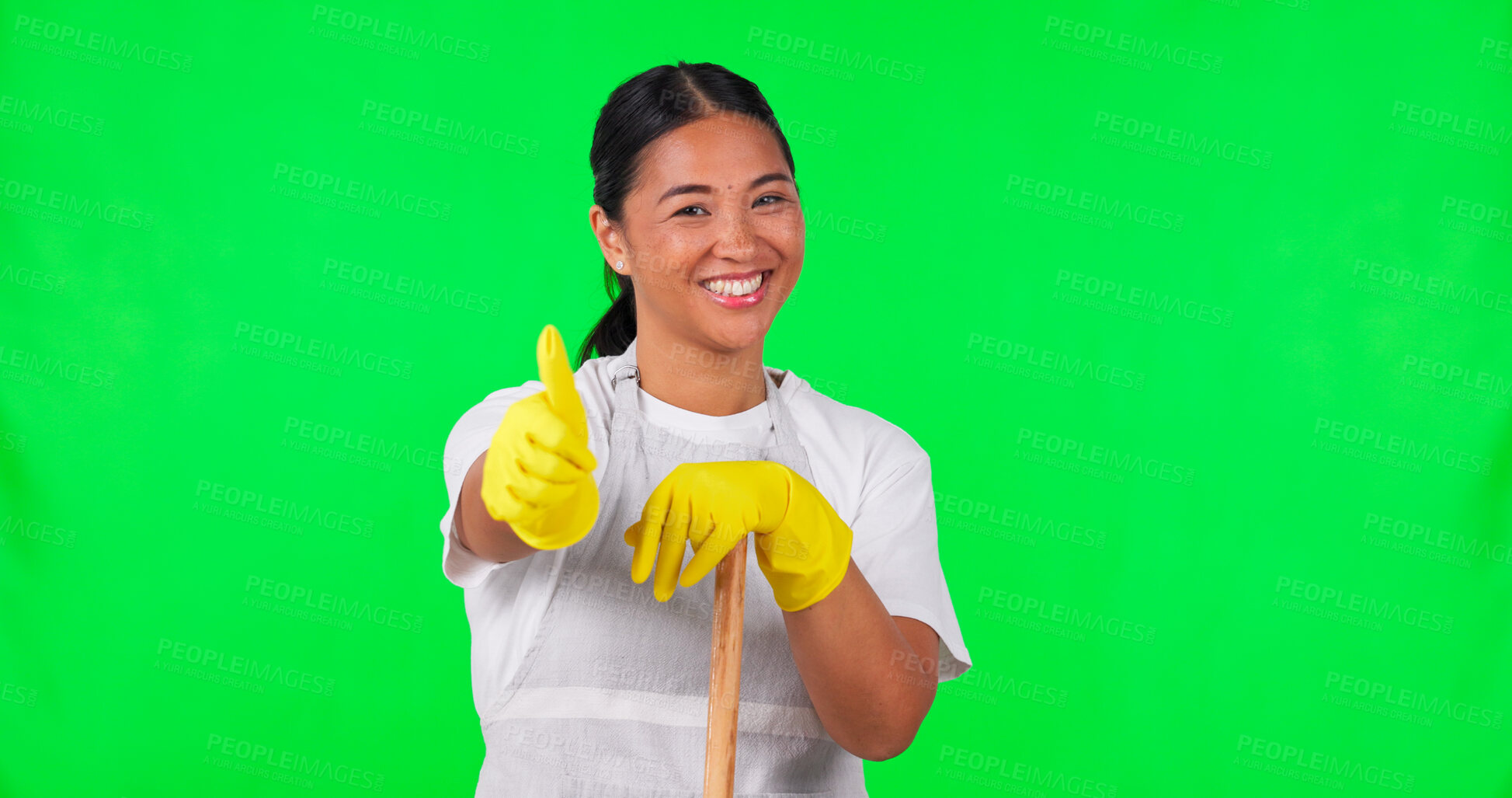 Buy stock photo Happy woman, portrait or thumbs up on green screen for cleaning, hygiene or success on studio background. Asian person, maid or cleaner with like gesture, broom or yes sign for maintenance agreement