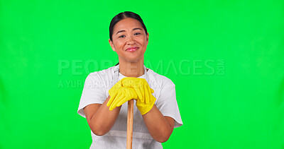 Woman, cleaner and face, green screen and broom with household maintenance and cleaning service. Disinfection, janitor and hygiene with female person and in gloves, mockup space on studio background