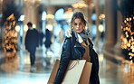Portrait, shopping bags and woman in city, customer and luxury with lights, promotion and purchase. Face, outdoor and model with discount deal, products on sale or client with items, buying or person