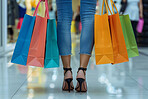 legs of person, walking and shopping bag at mall for promotion, retail therapy and customer discount. Shoes, woman and fashion in Milan for weekend holiday, purchase or sales in boutique store