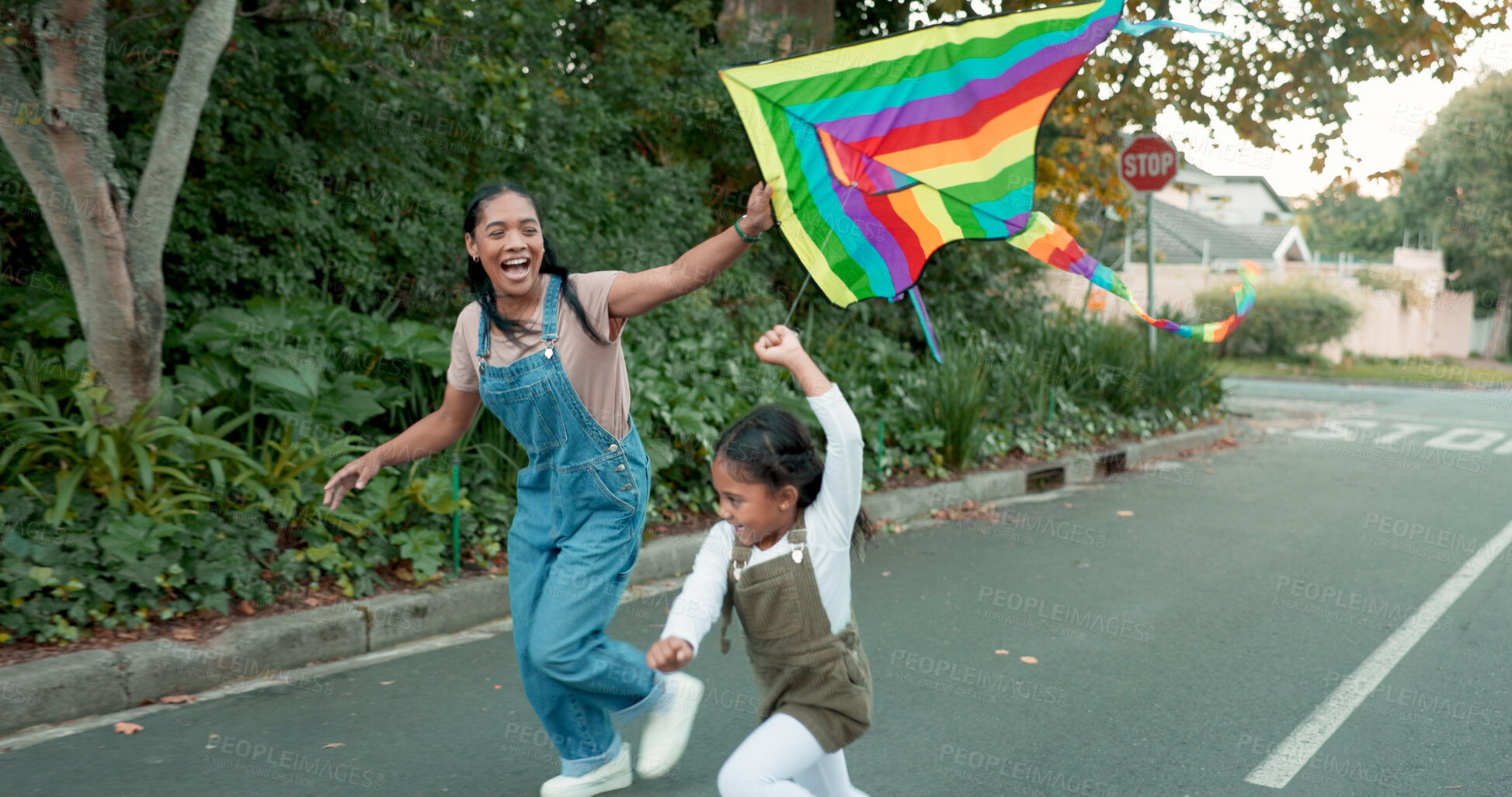 Buy stock photo Running, love or mother and daughter with kite in a road for freedom, games or fun outdoor. Flying, toy and mom with girl in a street for rainbow, celebration or support of LGBTQ, choice or lifestyle